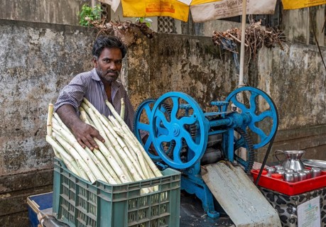 Portrait of street vendor of sugar cane juice