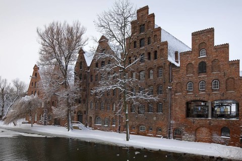 Historic salt warehouses in the snow in winter
