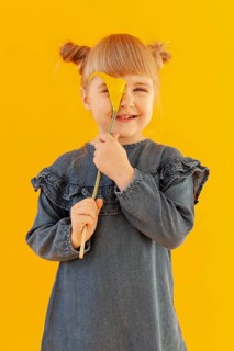 Happy girl holding calla lily flower