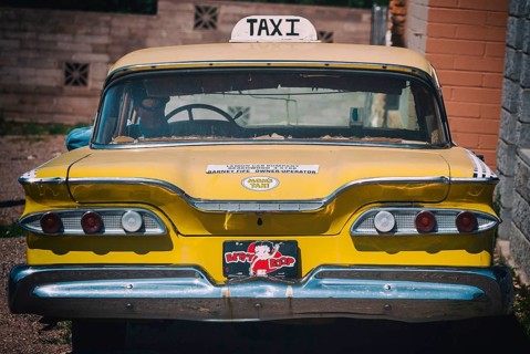 Old discarded Cadillac as a taxi
