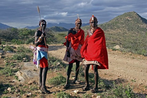 Portrait of Samburu warriors in traditional red dress with spears