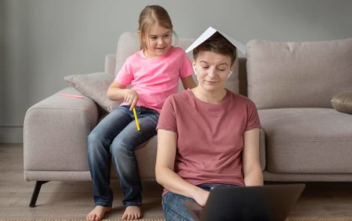 Medium shot parent working home
