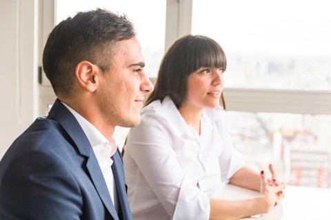 Portrait smiling young business couple office