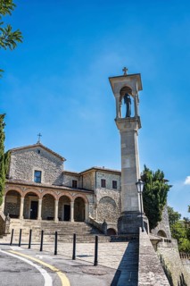 Monument to St Francis in front of the church of San Quirino