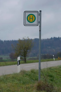 Bus stop sign at the roadside