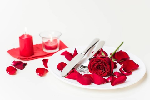 Red rose with cutlery plate