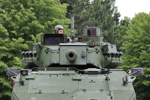Commander in turret of MOWAG Piranha IIIC armoured fighting vehicle of the Belgian army