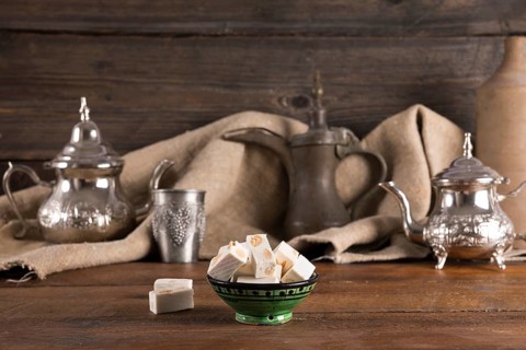 Turkish delight with teapots wooden table
