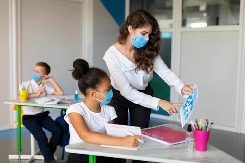 Woman showing pandemic prevention kid