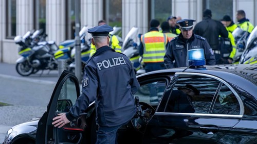 Police with yellow high-visibility waistcoats