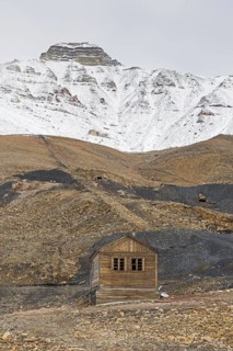Old wooden hut and adits