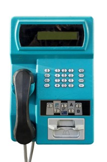 Old public payphone to be used with pre-payment card only in telephone booth from telecom provider against white background