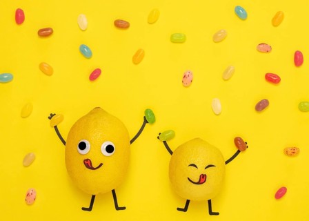 Top view lemons with candy