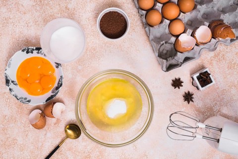 Various type ingredients making baked cake textured backdrop