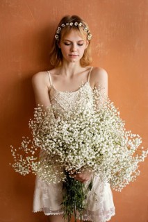 Woman posing with bouquet beautiful flowers