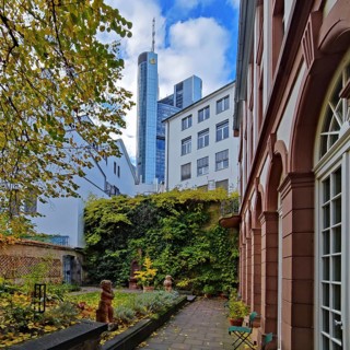 View of the garden of the Goethe House with Commerzbank Tower