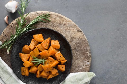 Top view sweet potatoes black plate