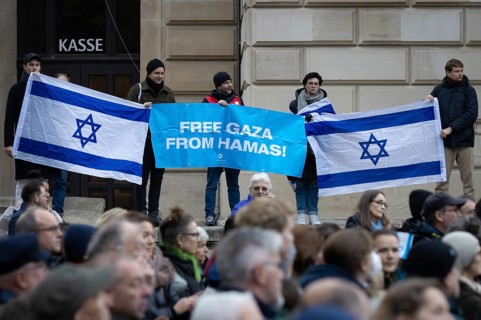 FREE GAZA FROM HAMAS! is written on a banner. Under the motto Never again is now