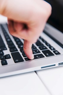 Person pressing enter key