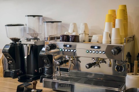 Front view coffee machine with loads cups