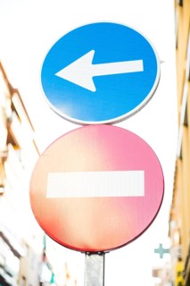 Red stop street sign directional sign road