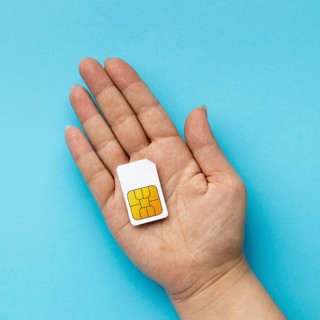 Top view hand holding sim card