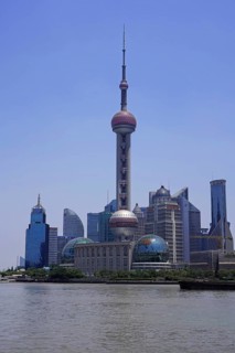 View from The Bund across the Huangpu River to the skyline of the Pudong Special Economic Zone with Oriental Pearl Tower