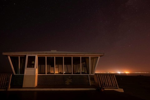 Pelican Point lighthouse with starry sky