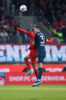 Keven SCHLOTTERBECK VFL Bochum in aerial battle with Eren DINKCI 1. FC Heidenheim li