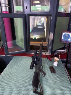 Modern 300 Meters Shooting Range with an Assault Rifle in an Illuminated Underground Tunnel in Switzerland