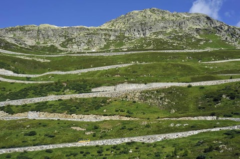 Road with hairpin curves winding over the Grimsel Pass in the Swiss Alps