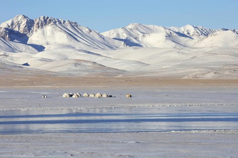 Yurts in traditional Kyrgyz yurt camp in the snow along Song Kul