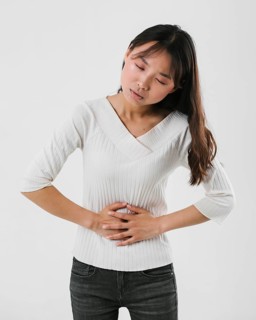 Front view woman having stomachache