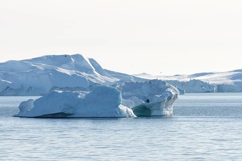 Icebergs in the UNESCO World Heritage Ilulissat Icefjord in the evening sun. Disko Bay