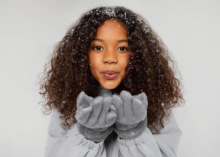 Close up girl wearing gloves