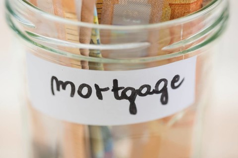 Euro notes saving mortgage glass jar