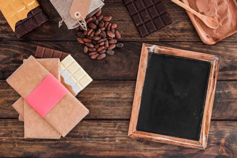 Chocolate bar stack blank wooden slate cocoa beans powder table