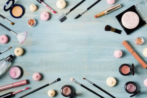 Creative arrangement cosmetics colored surface