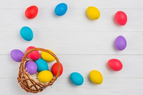 Frame from easter eggs basket wooden table