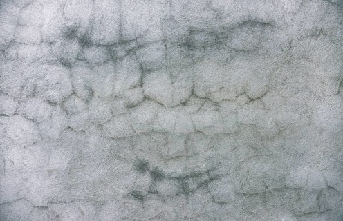 Cracked cement wall background. Textured and cracked wall. Textured old wall background. Texture of a gray wall. Old wall with cracked texture