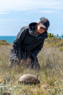 Woman and a dwarf armadillo