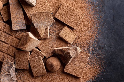 Flat lay candy with chocolate cocoa powder