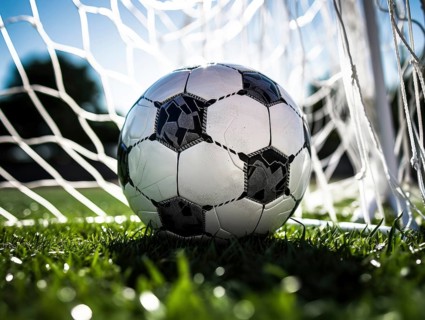 Football with grass and goal net