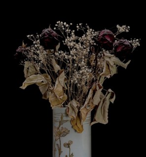 Dried bouquet of roses in a vase