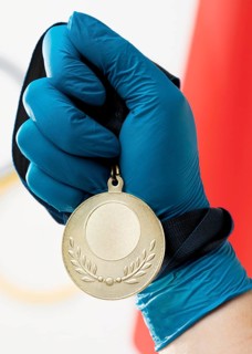 Person holding medal close up