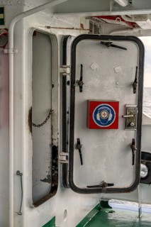 Steel door to the engine room on an excursion boat