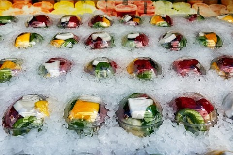 Freshly cut and ready-to-cook fruit in plastic cups