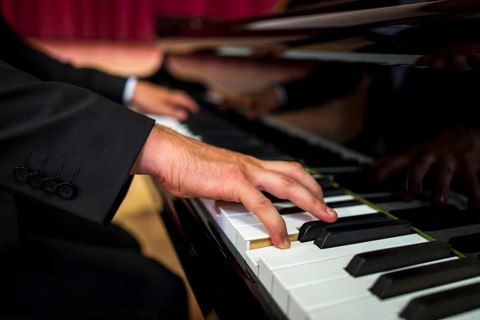 Close up musician playing piano