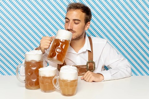 Front view man drinking blonde beer
