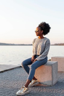 African woman wearing sunglasses looking away